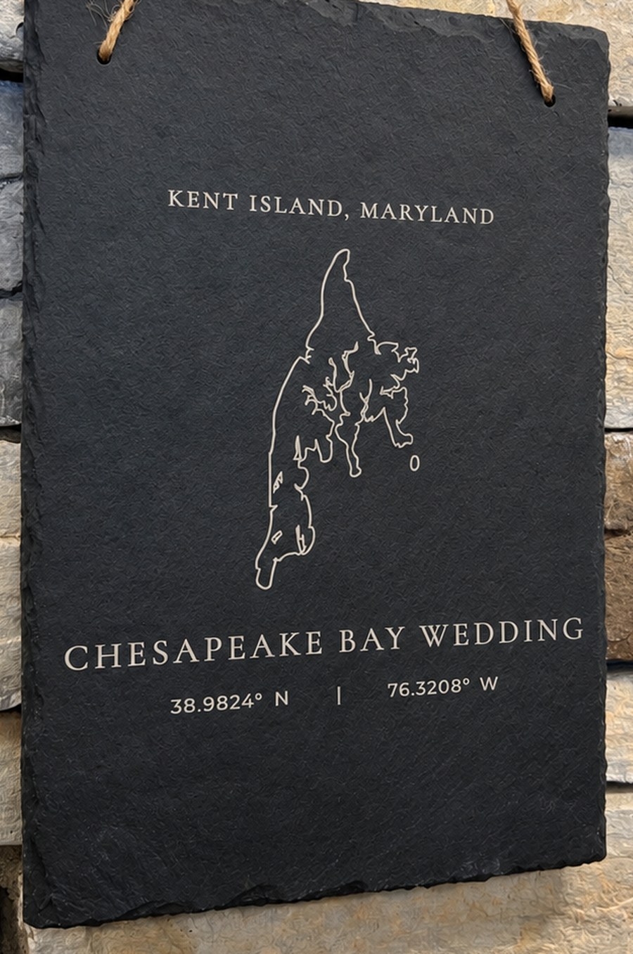Engraved slate sign with a Kent Island outline reading Chesapeake Bay Wedding